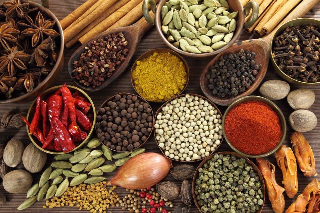 Spices and herbs on wooden surface
