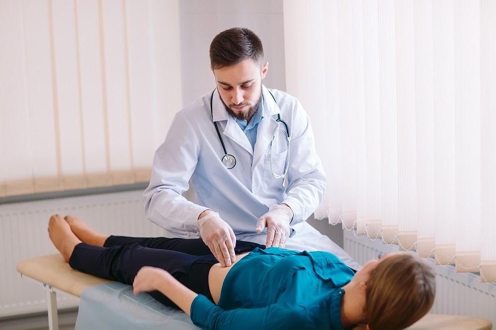 woman gettiching checked for gastroenteritis