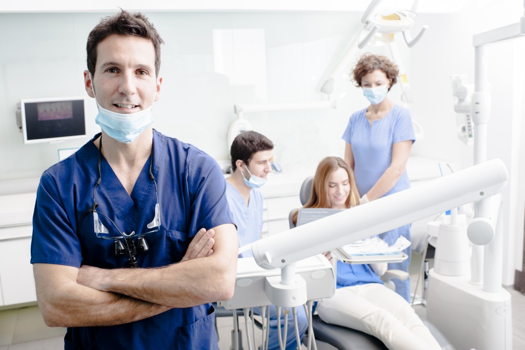 dentist with his team working