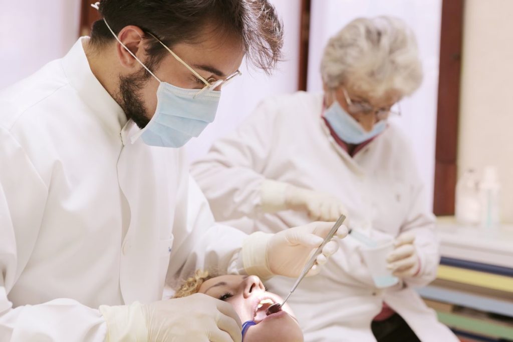 dentists attending to patient