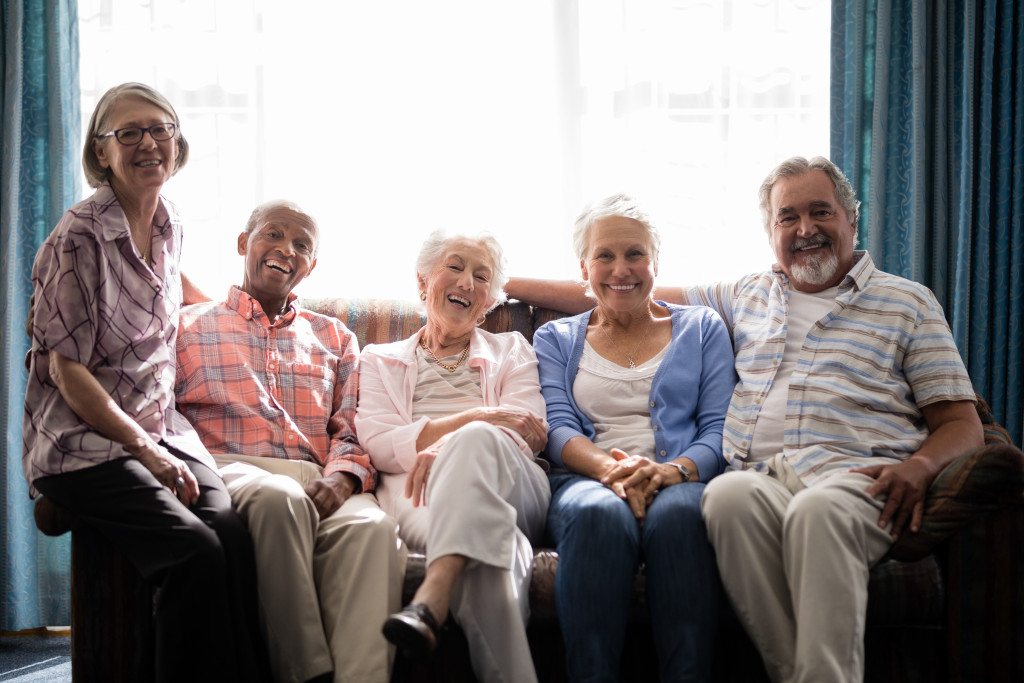 A group of seniors smiling towards the camera