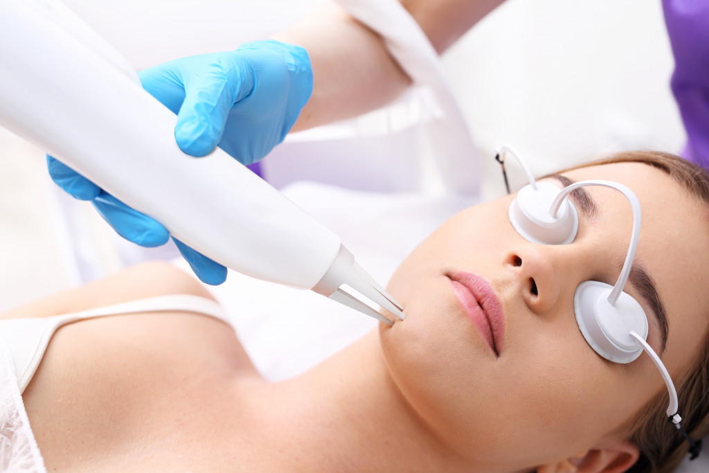 a woman getting a laser skin treatment 