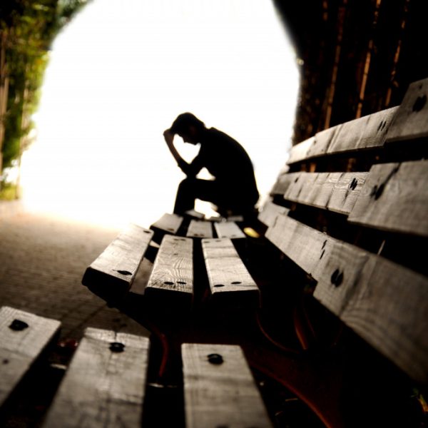 Depressed person in park